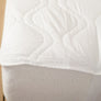Couvre matelas avec ancrage élastique qui tient bien au matelas par Otelia Maison